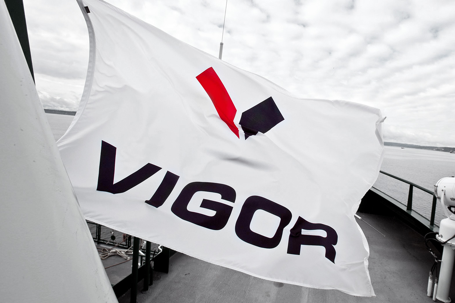 Shipbuilding logo design. Vigor logo on a ship's flag By William Moschell Design Works. Honolulu, Hawaii logo graphic designer.