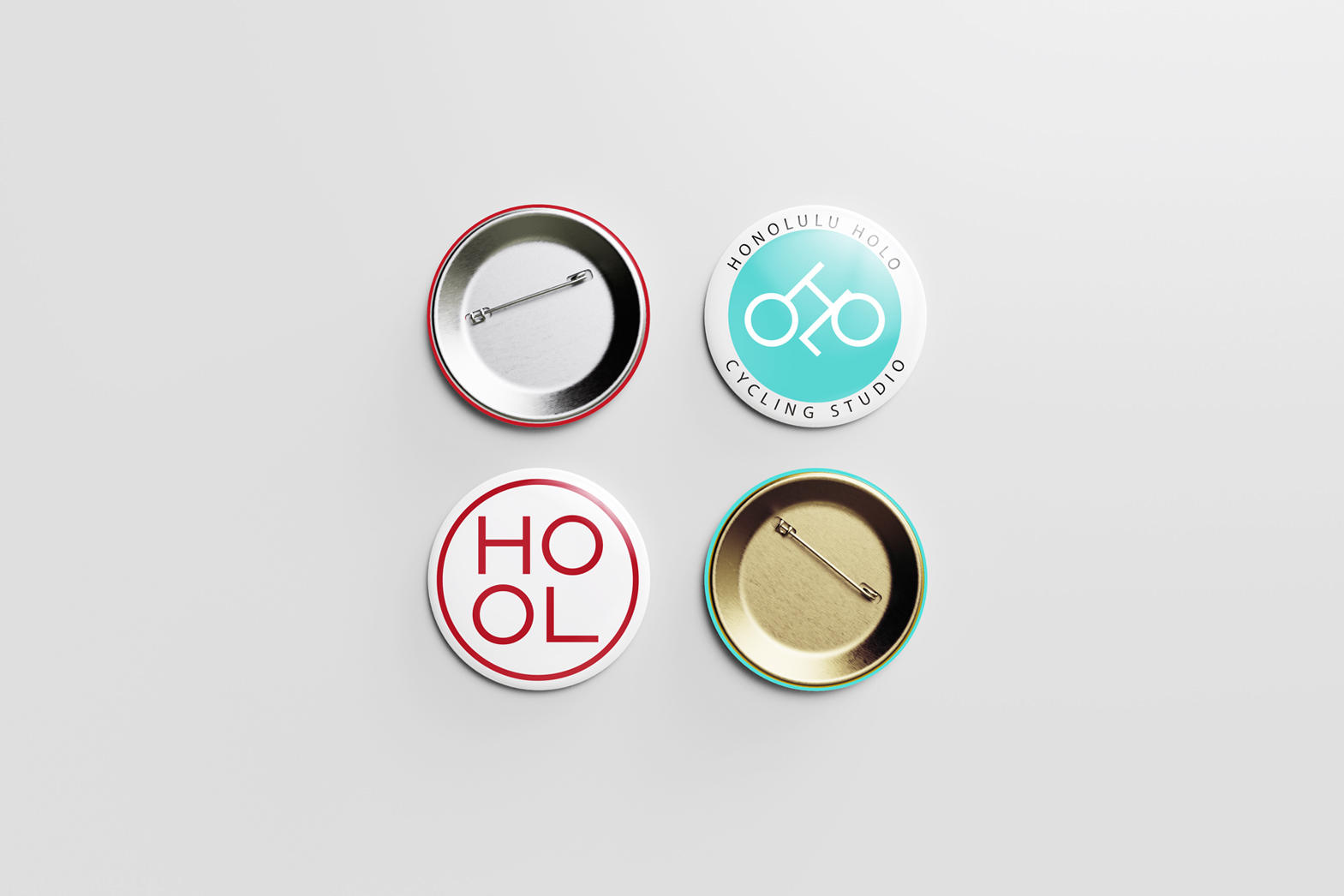 Promotional design. Honolulu Holo graphic design marks on round shirt buttons. By William Moschell Design Works. Honolulu, Hawaii logo button graphic designer.