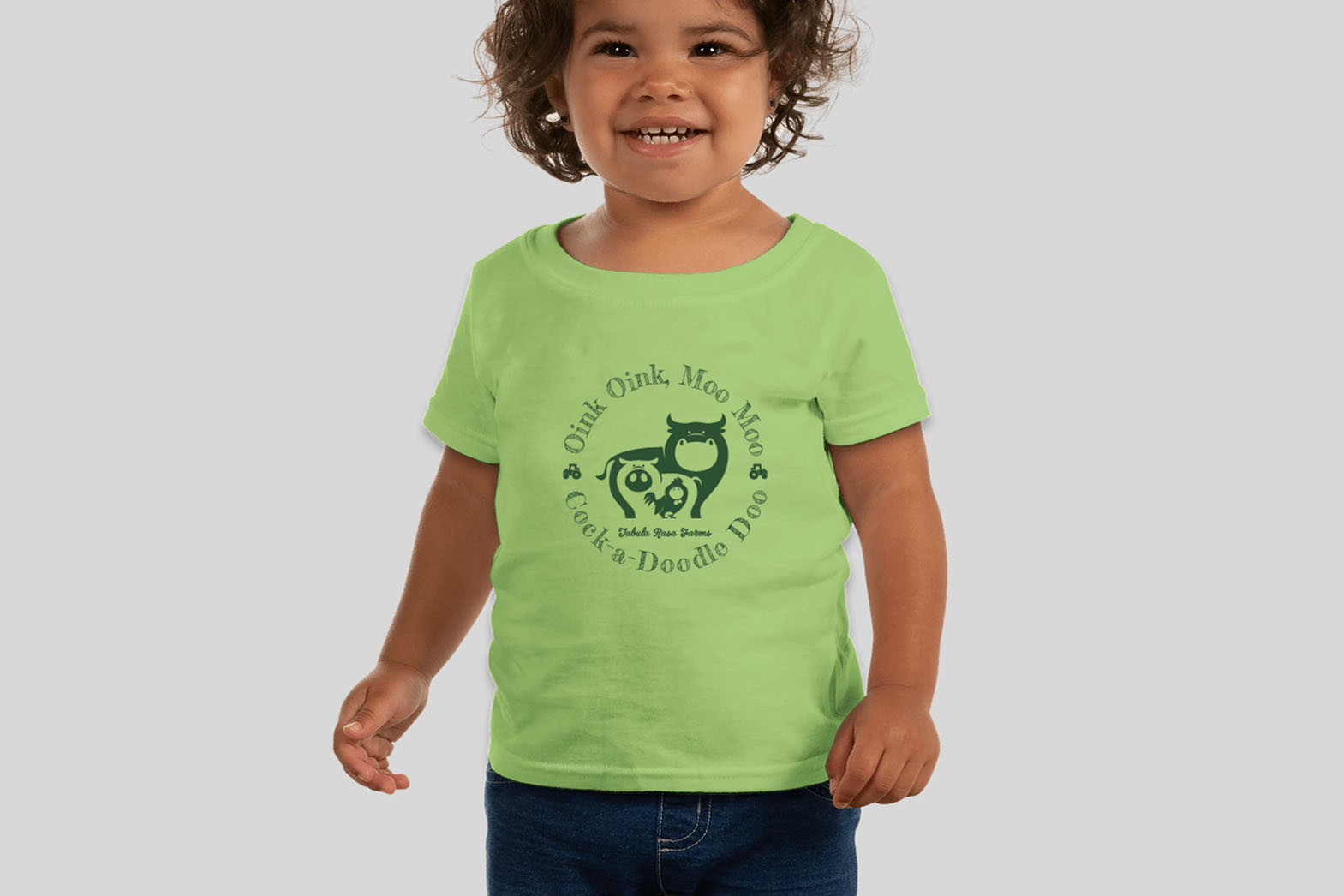 Toddler wearing a shirt with the words oink oink, moo moo, cock-a-doodle-doo